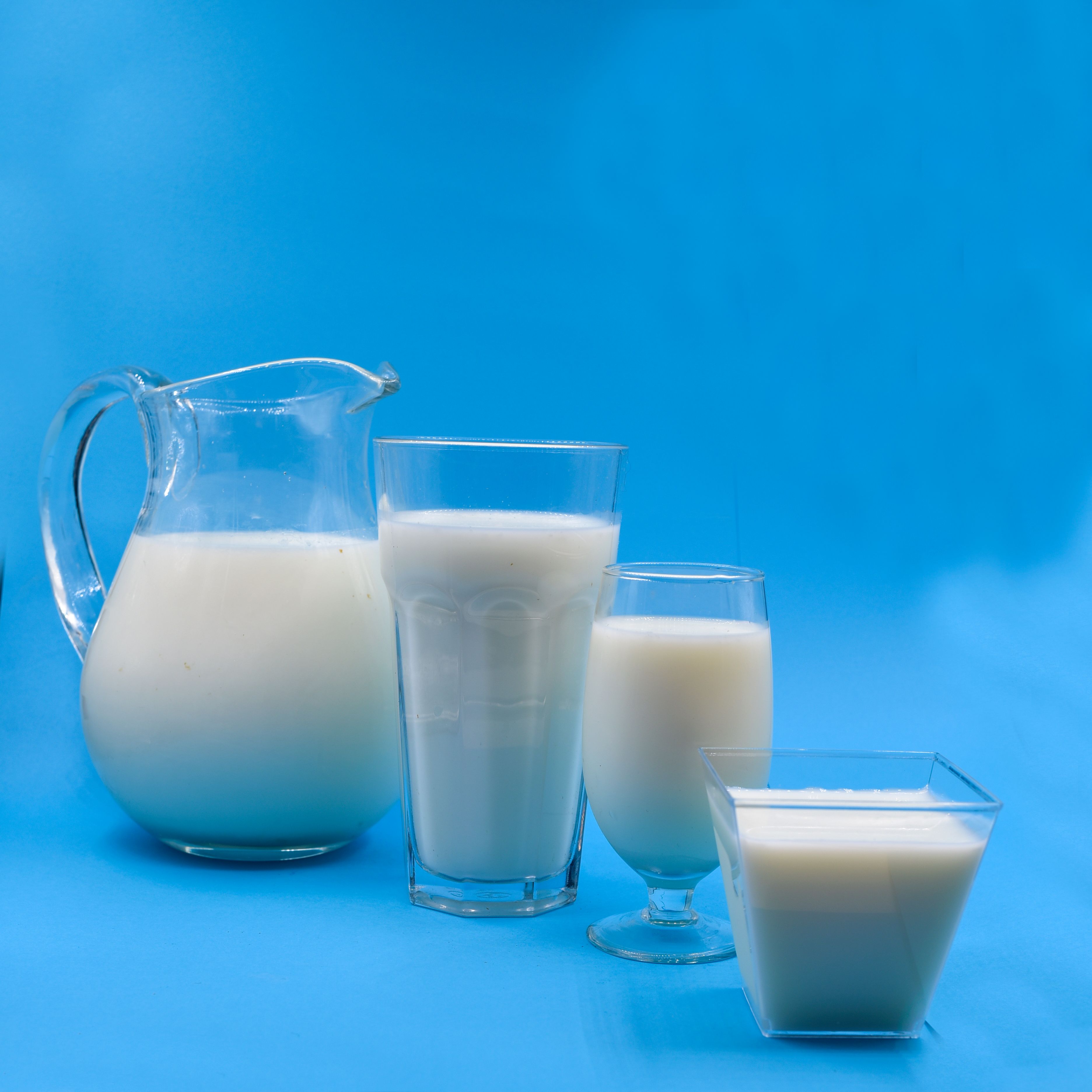 Macro photograph of milk pouring into a glass